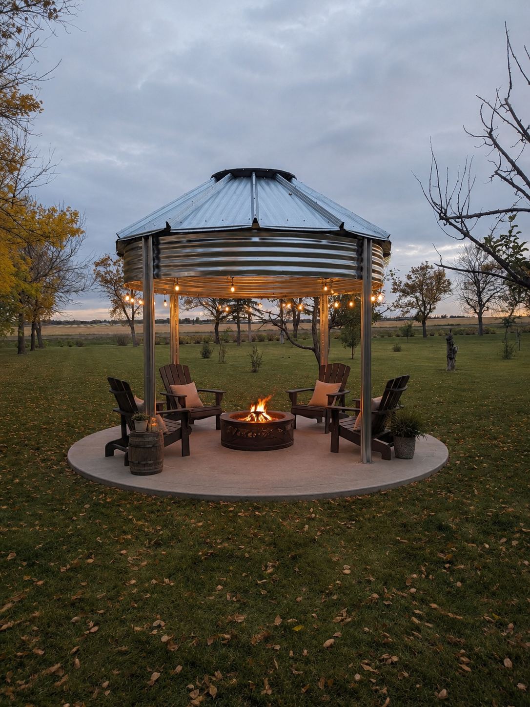 Binzebo on a rural property at dusk with chairs gathered around a fire pit